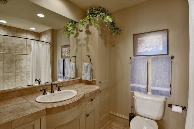 bathroom with tile patterned floors, vanity, curtained shower, and toilet