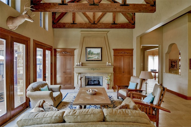 living room featuring beam ceiling, light tile patterned floors, and high vaulted ceiling