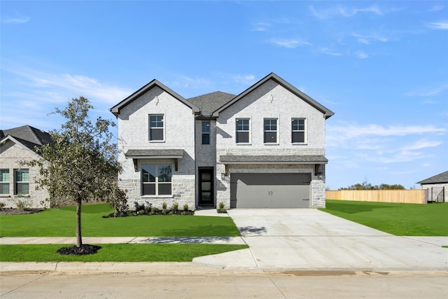 7513 Wild Mint Trl, Midlothian, TX 76084 - view of front facade with driveway, an attached garage, and stone siding