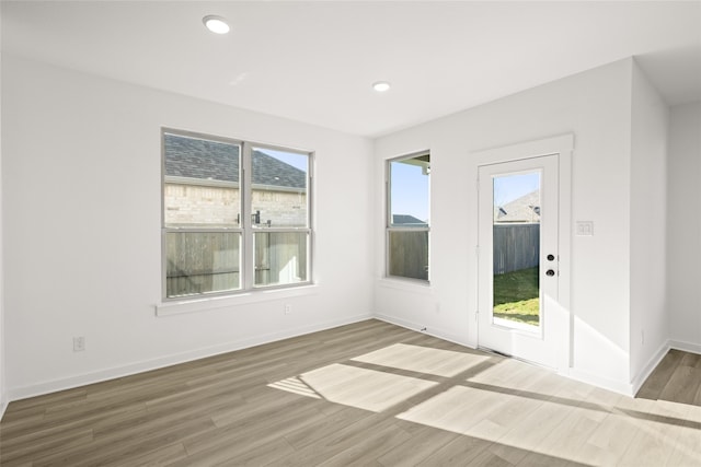 7513 Wild Mint Trl, Midlothian, TX 76084 - empty room featuring wood finished floors, baseboards, and recessed lighting