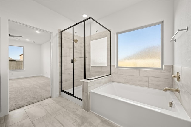 7513 Wild Mint Trl, Midlothian, TX 76084 - full bath with healthy amount of natural light, a garden tub, a stall shower, a ceiling fan, and recessed lighting