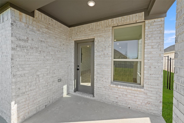 7513 Wild Mint Trl, Midlothian, TX 76084 - entrance to property with brick siding and a patio area