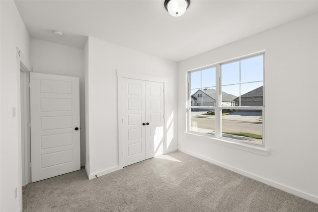 7513 Wild Mint Trl, Midlothian, TX 76084 - unfurnished bedroom with carpet floors, baseboards, and a closet