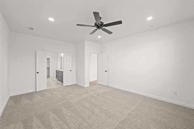 7513 Wild Mint Trl, Midlothian, TX 76084 - unfurnished bedroom featuring light colored carpet, recessed lighting, baseboards, connected bathroom, and ceiling fan