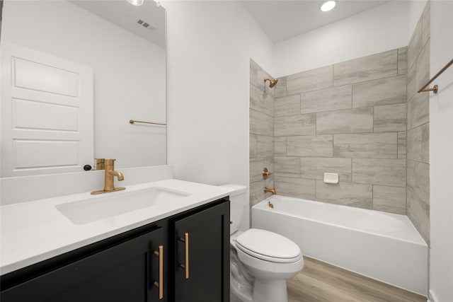 7513 Wild Mint Trl, Midlothian, TX 76084 - full bath featuring wood finished floors, toilet, vanity, tub / shower combination, and recessed lighting