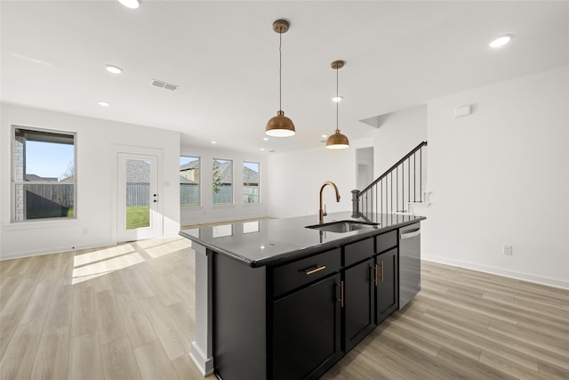 7513 Wild Mint Trl, Midlothian, TX 76084 - kitchen with a sink, stainless steel dishwasher, dark cabinetry, recessed lighting, and light wood-type flooring