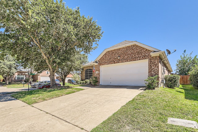 view of front of property with a front yard and a garage