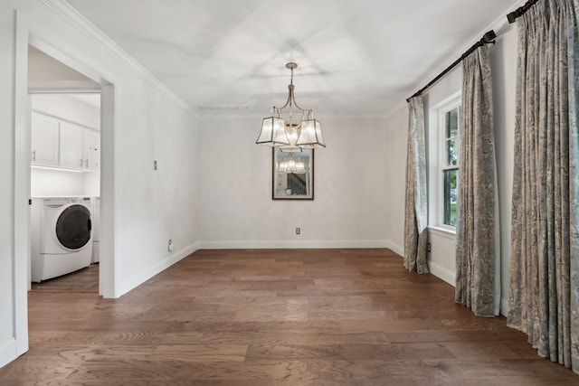 unfurnished dining area with a chandelier, washer / clothes dryer, dark hardwood / wood-style floors, and crown molding