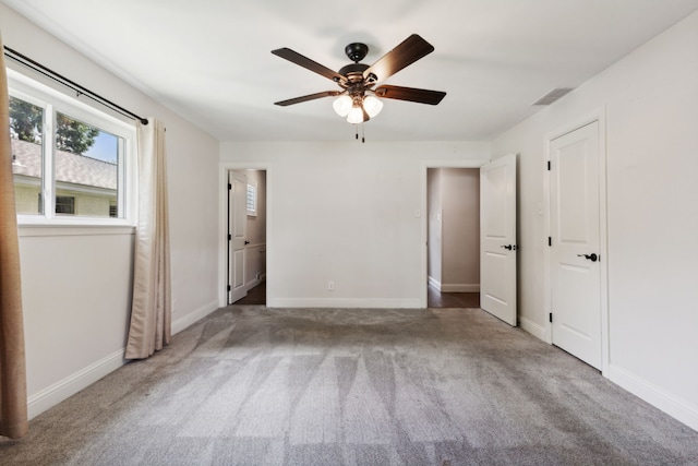 unfurnished bedroom with ceiling fan and carpet floors