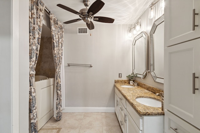 bathroom featuring ceiling fan, tile patterned flooring, and vanity