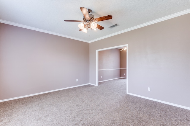 unfurnished room featuring carpet floors, a textured ceiling, ornamental molding, and ceiling fan