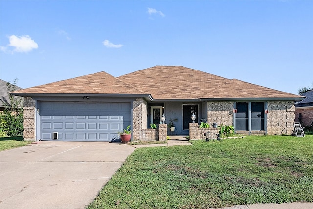 ranch-style home with a garage and a front lawn