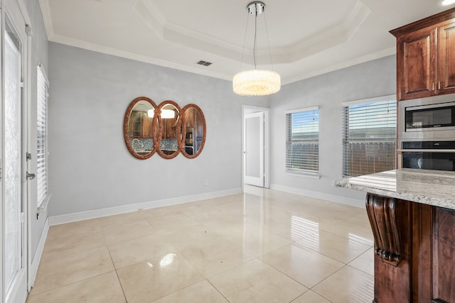 unfurnished dining area featuring a raised ceiling, ornamental molding, and light tile patterned floors