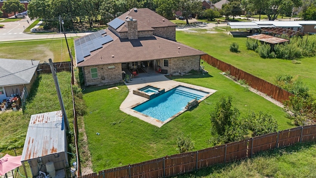 view of swimming pool featuring a yard and a patio area