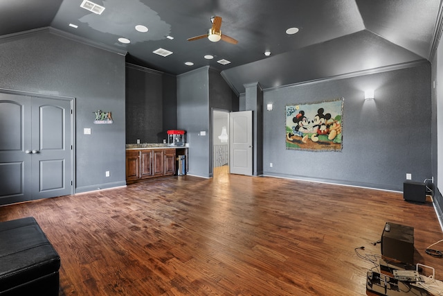 cinema featuring ceiling fan, lofted ceiling, crown molding, and dark hardwood / wood-style floors