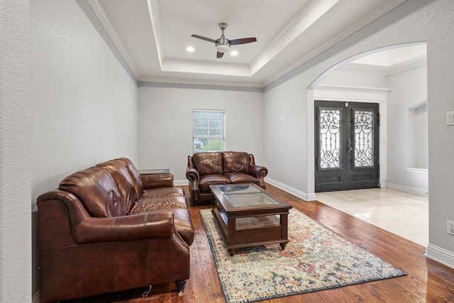 living room featuring ornamental molding, ceiling fan, and hardwood / wood-style floors