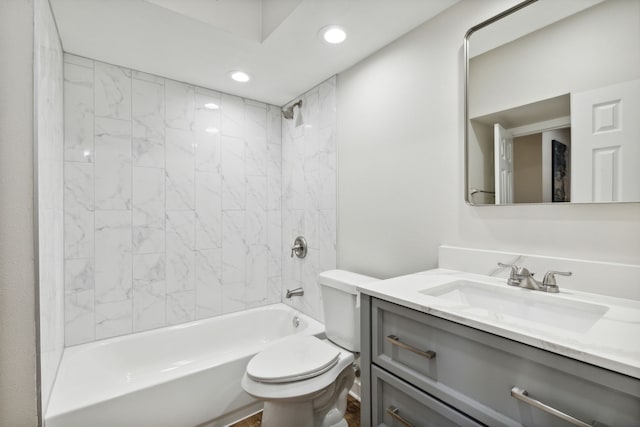 full bathroom with vanity, toilet, and tiled shower / bath