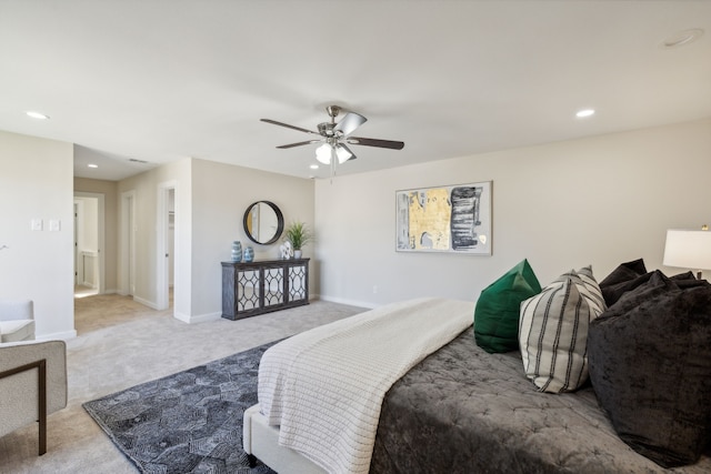 bedroom with light carpet and ceiling fan