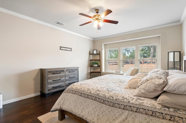 bedroom with ornamental molding, ceiling fan, and dark wood-type flooring