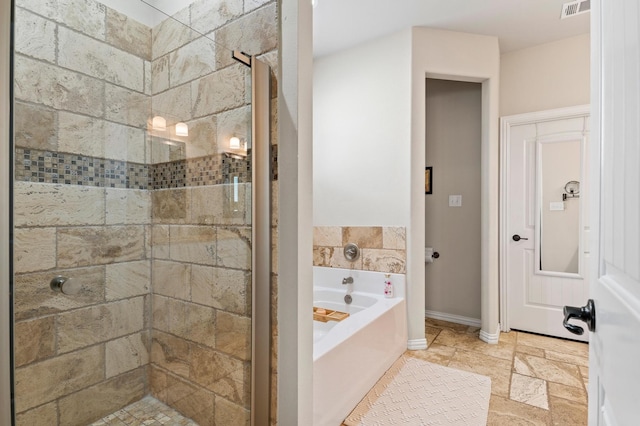 bathroom featuring plus walk in shower