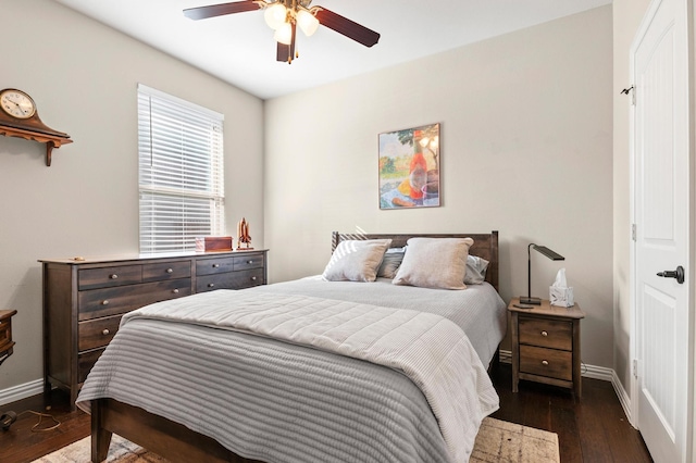 bedroom featuring ceiling fan and dark wood-type flooring