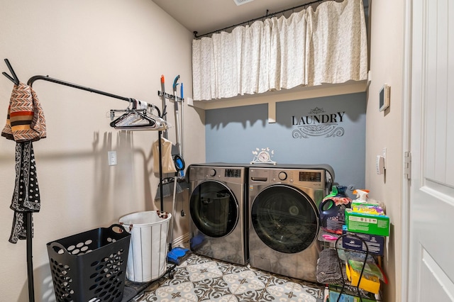 laundry area with washing machine and clothes dryer