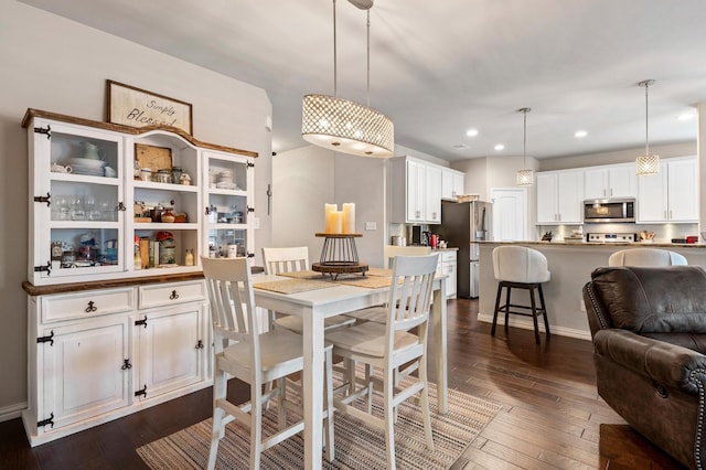 dining space featuring dark hardwood / wood-style flooring