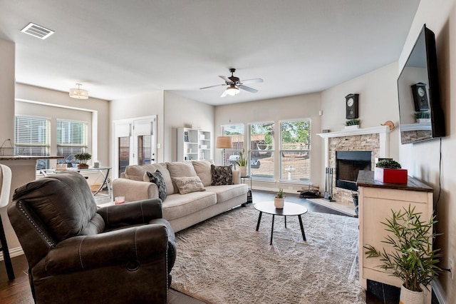 living room with ceiling fan and hardwood / wood-style flooring