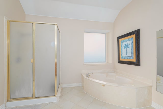 bathroom with shower with separate bathtub, lofted ceiling, and tile patterned floors