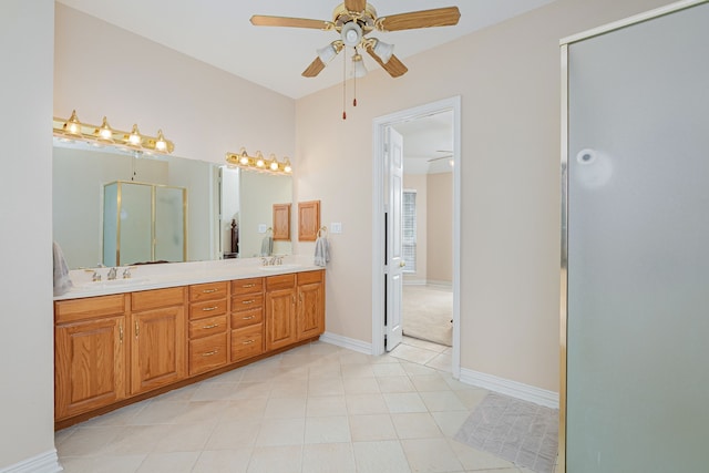 bathroom with ceiling fan, vanity, walk in shower, and tile patterned floors