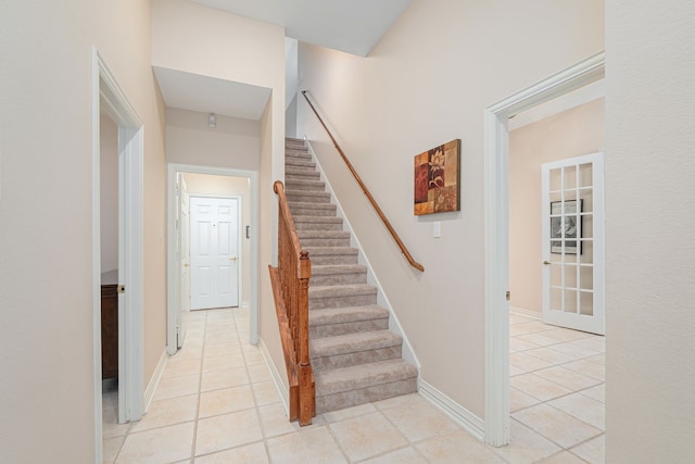 stairs featuring tile patterned flooring