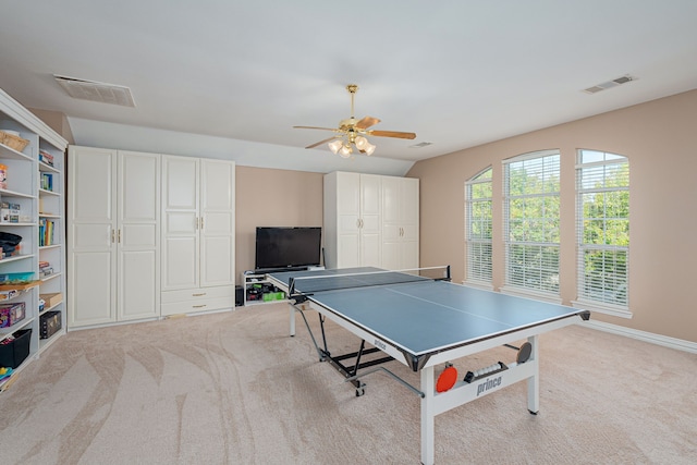 playroom with ceiling fan and light colored carpet