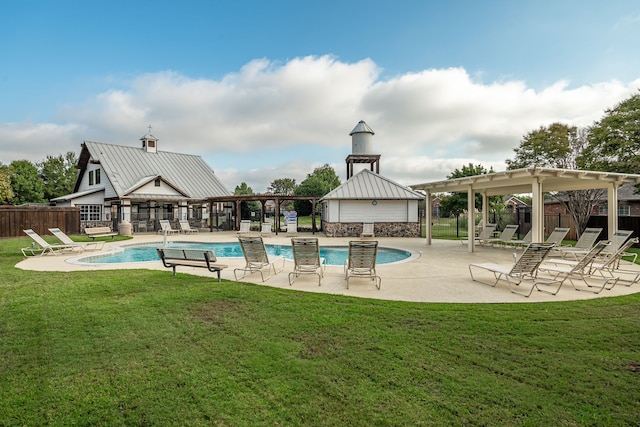 view of pool featuring a yard and a patio area