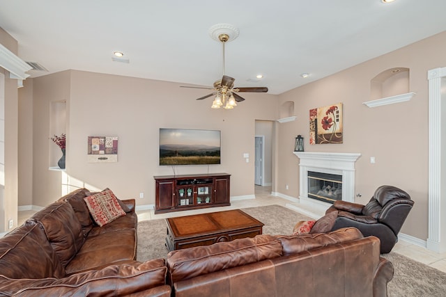 living room featuring ceiling fan and light tile patterned flooring