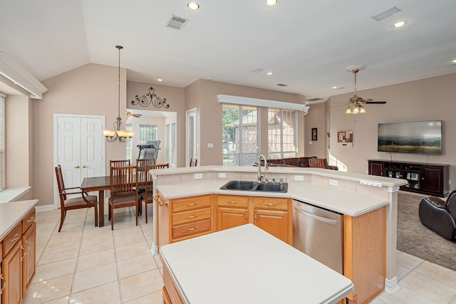 kitchen featuring ceiling fan with notable chandelier, dishwasher, a kitchen island with sink, and sink