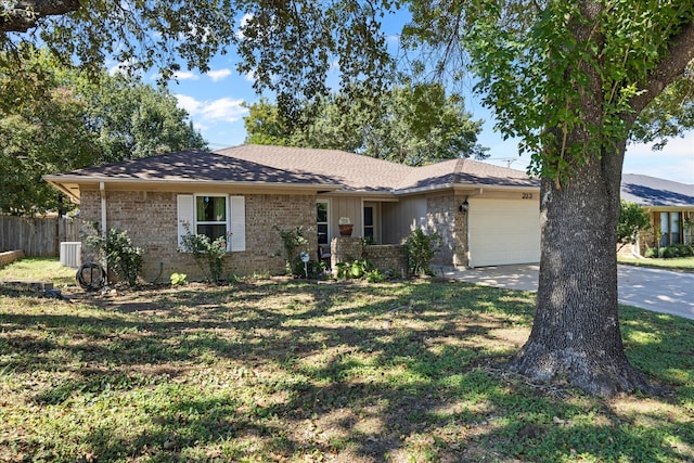 single story home with central AC unit, a garage, and a front lawn