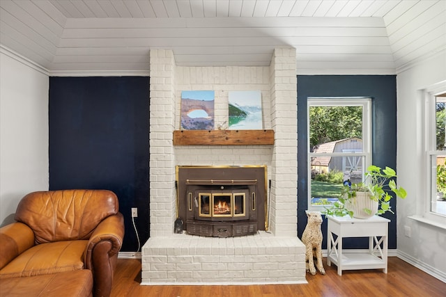 living room with wood ceiling, a fireplace, and hardwood / wood-style floors