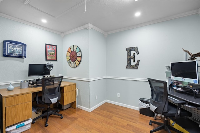 office with ornamental molding and light hardwood / wood-style flooring