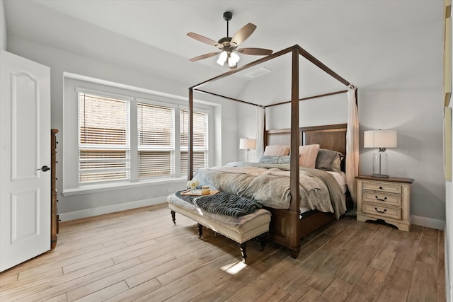 bedroom with light hardwood / wood-style floors and ceiling fan