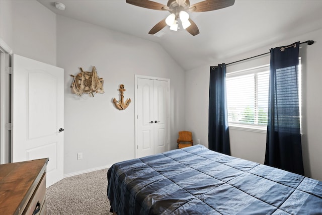 bedroom with carpet, vaulted ceiling, a closet, and ceiling fan