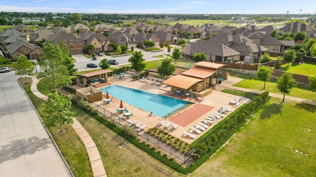 view of swimming pool with a lawn and a patio area