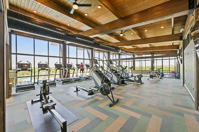 exercise room featuring carpet, wood ceiling, and ceiling fan