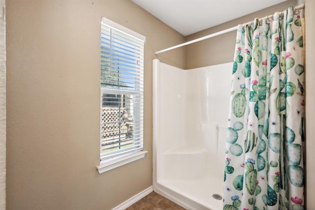 115 Rosser Ranch Rd, Graham, TX 76450 - bathroom with a shower with curtain, baseboards, and tile patterned flooring
