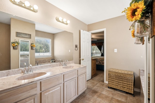 bathroom featuring tile patterned floors and vanity