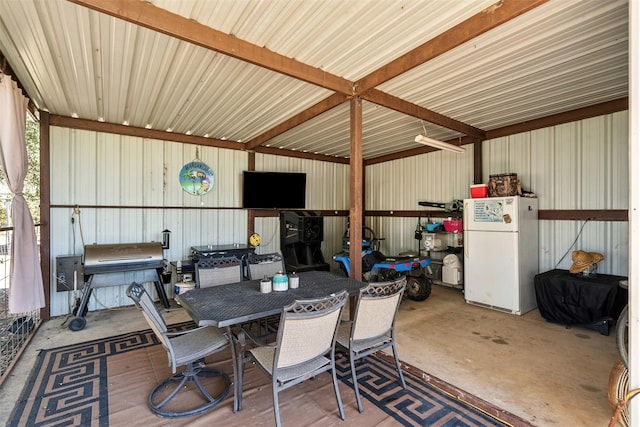 115 Rosser Ranch Rd, Graham, TX 76450 - garage with freestanding refrigerator and metal wall