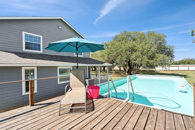 view of swimming pool featuring a wooden deck