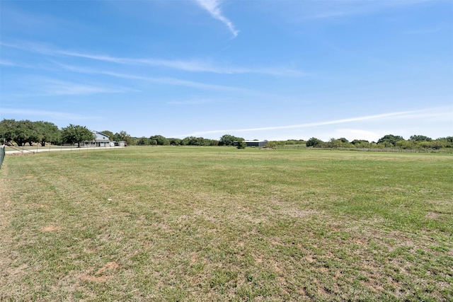 view of yard with a rural view