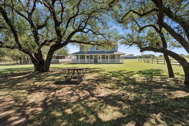 view of yard with covered porch