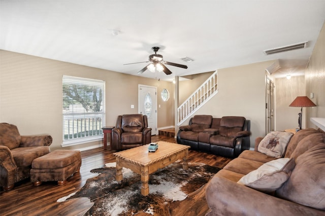 living room featuring wood-type flooring and ceiling fan