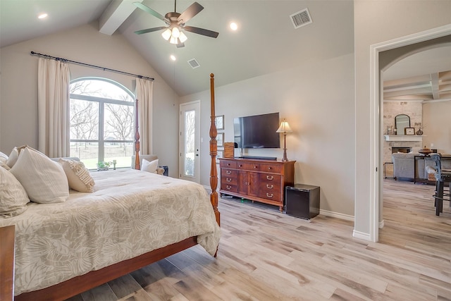 bedroom with light hardwood / wood-style flooring, ceiling fan, and lofted ceiling with beams